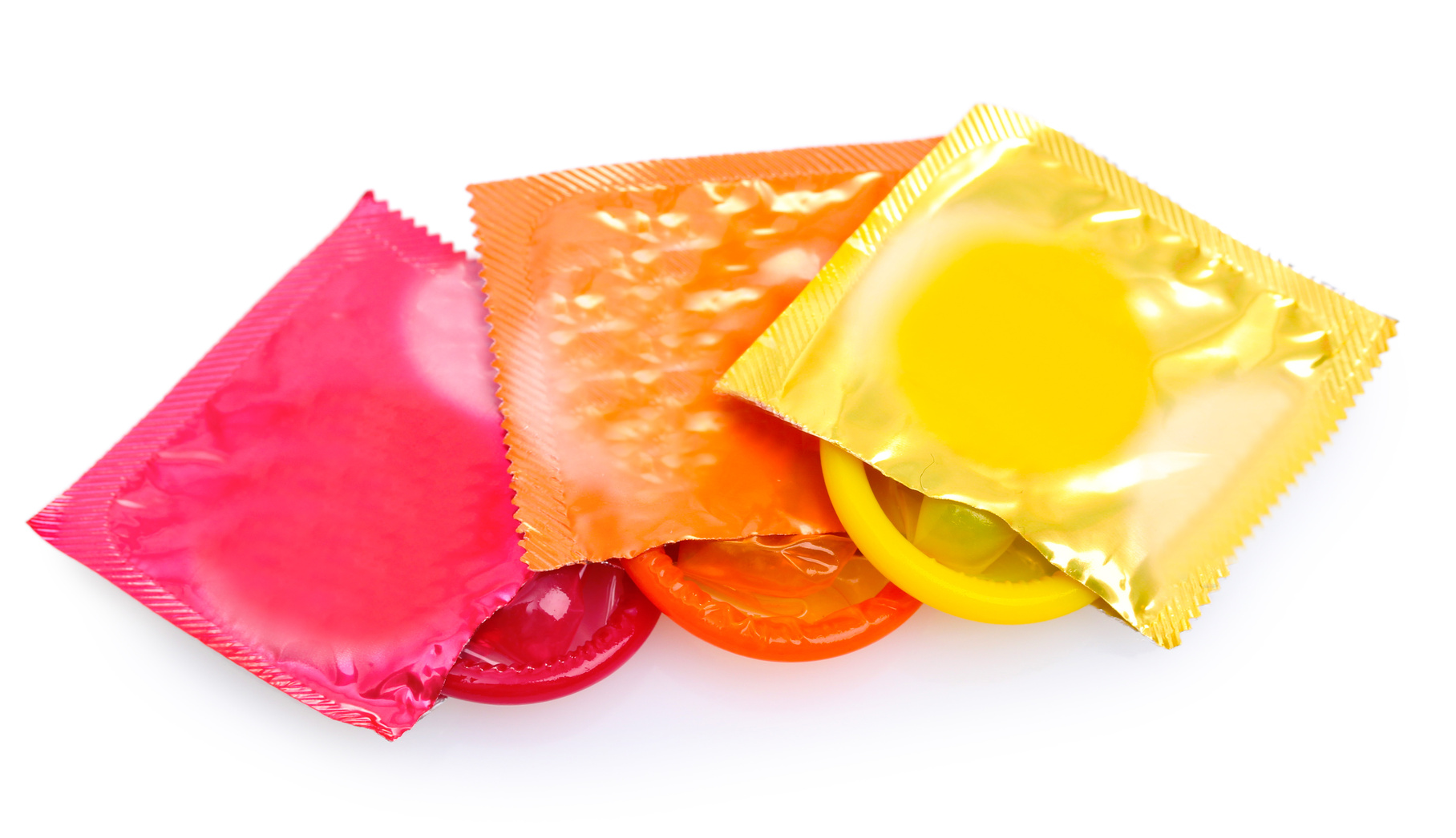 Colorful condoms isolated on white